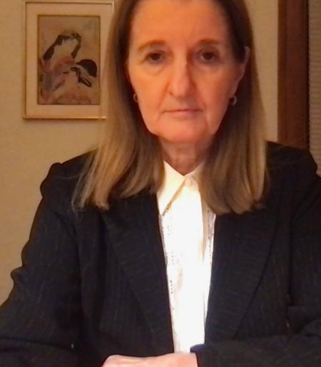 Headshot of Cathy Caruth in a black suit jacket and white shirt. 