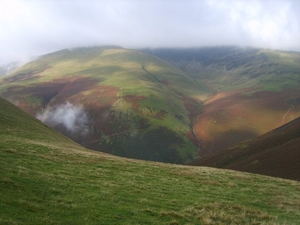 Black Combe, as it is usually spelled, is a fell in the southwest corner of Lake District National Park. Standing 1,970 feet, it looks out over the Irish Sea. Photo: Black Combe in a mist from White Hall Knott ridge (Michael Graham, geograph.org.uk).