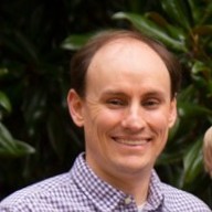 Color photograph of Brian Neff in a button down shirt.