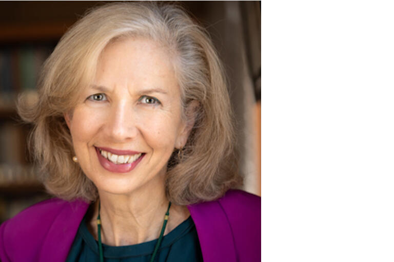 Color photograph of Celeste Langan in a magenta jacket.