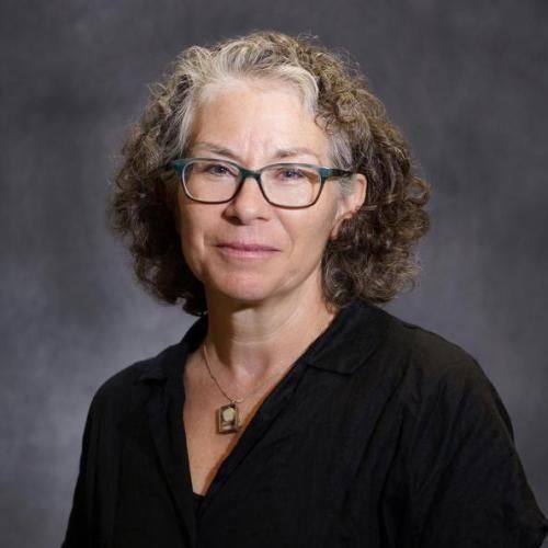 Color headshot of Charlotte Sussman wearing glasses.