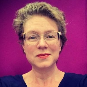 Color headshot of Bethany Nowviskie in front of a magenta background.
