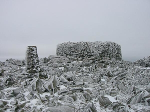 In Lake District parlance, “stone man” is another name for a cairn, or pyramid of rocks. Photo: Scafell Pike's summit cairn in a winter sunset (Stephen Middlemiss).